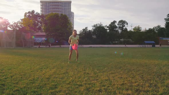Young and Beautiful Woman Playing Frisbee in the Park Slow Motion alt