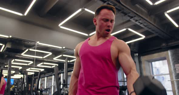 Bodybuilder Doing Arms Exercises In Gym Naked Torso. Handsome Power Athletic Man In Training alt