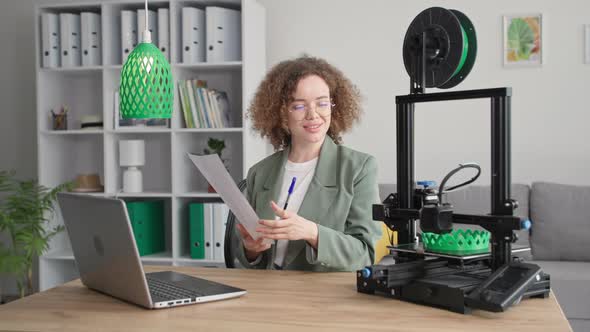 Smart Young Woman Uses Modern Technology to Create a 3D Model Design on a Computer for Printing on a alt