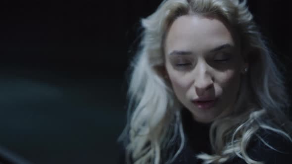 Model Face Woman Posing at Night in Driving Tunnel Urban Area alt