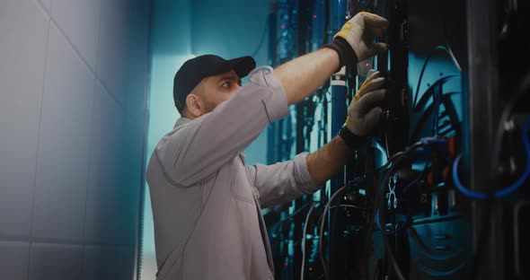 Male Technician Finishing Wire Checking alt