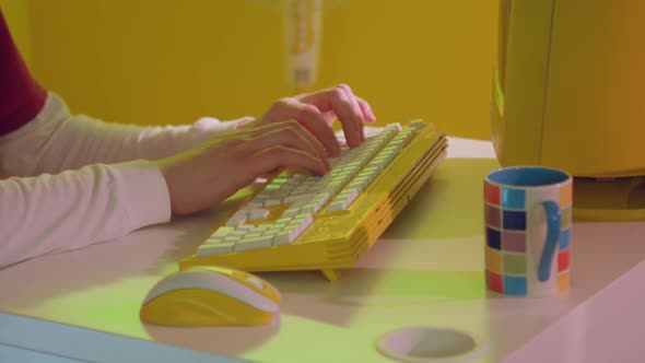 Man Is Typing On Yellow Keyboard