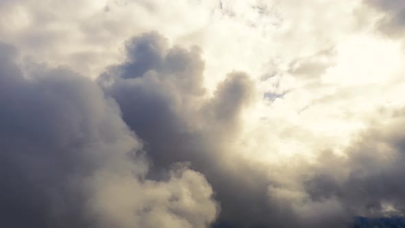 Time lapse storm sky with clouds background. Flight through the moving cloudscape