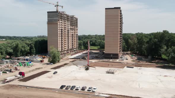 Aerial View  Road Construction Site and a Big Pump for Concrete Pouring Road alt