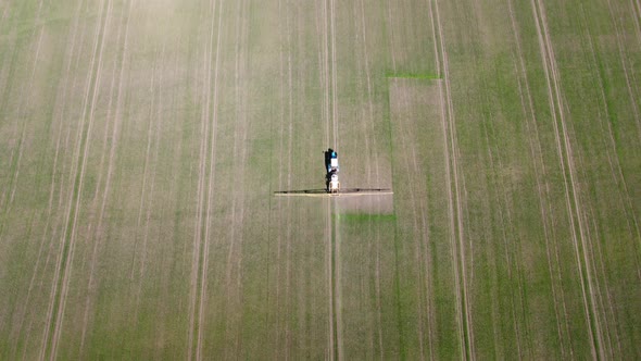 Processing of Agricultural Fields with Fertilizers and Pesticides From Weeds and Pests