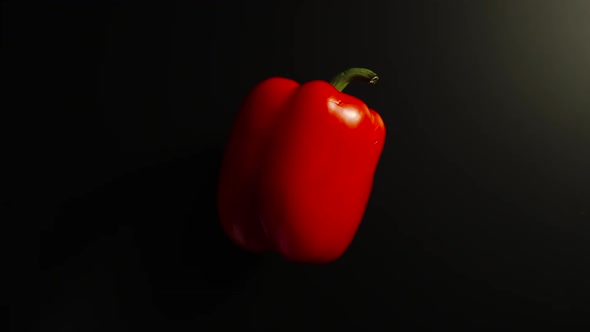 Bell Pepper On A Side Rotates On A Black Surface