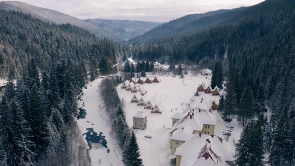 Aerial View of Snowed Winter Road in Carpathian Mountains Ukraine Bukovel alt