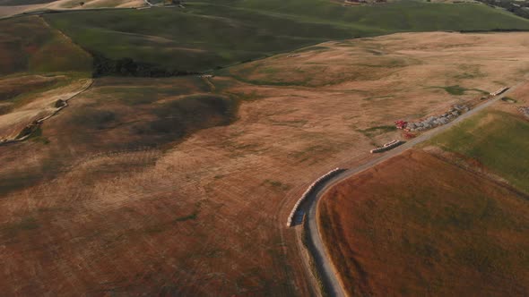 Aerial shot of a hilly countryside Val d'orcia ,TUSCANY,ITALY alt