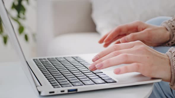 Cropped Shot of Female Hands Typing Text on Computer Keyboard Indoor Closeup Fingers of Caucasian alt