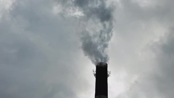 smoke and steam from the boiler room or factory pipe. environmental emissions, pollution and global