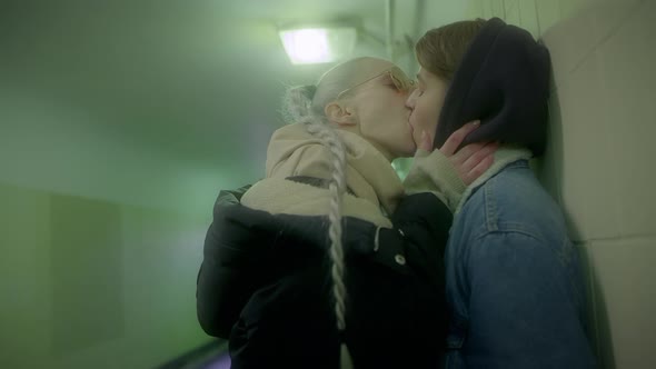 Two Girls Passionately Kissing in the Underpass