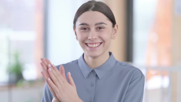 Portrait of Young Latin Woman Clapping Appreciating alt