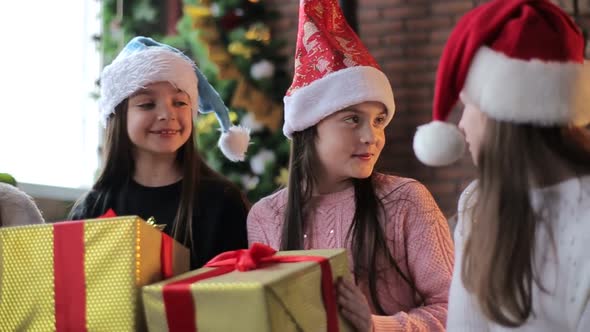 a group of children with New Year's gifts, happy friends for Christmas alt