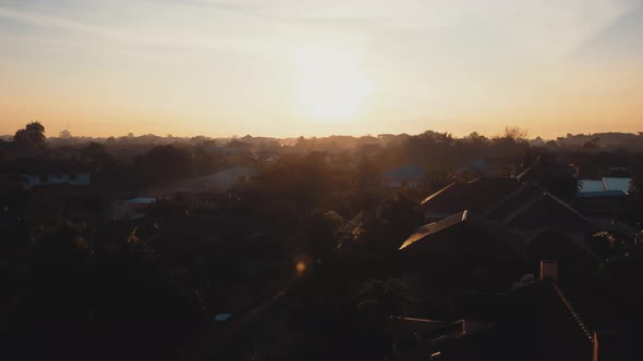Establishing Aerial View Shot sunrise above asia village in morning