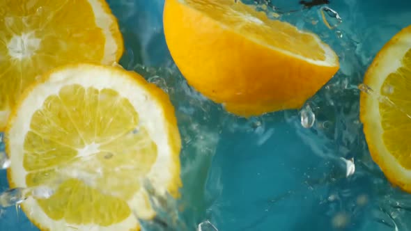 Citrus Orange Slice Splashing Into Water