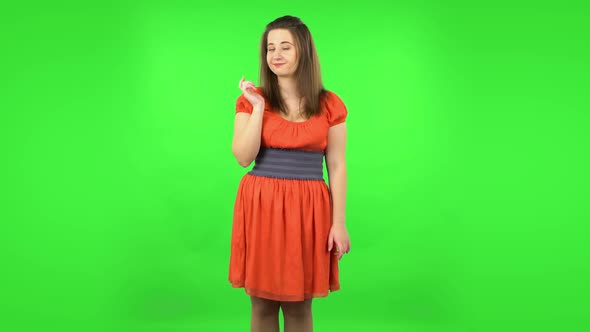 Cute Girl Coquettishly Smiling, Waving Hand and Showing Gesture Come Here. Green Screen alt