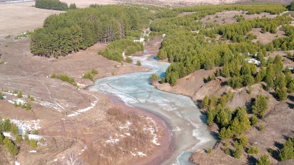 Grass Under the Snow. Frozen River in the Field alt