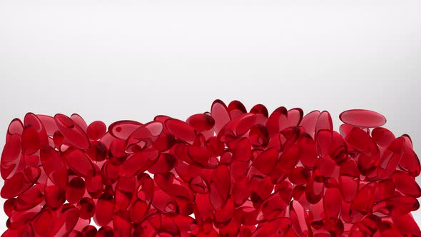 Hundreds Of Red Translucent Pills Filling Up White Background