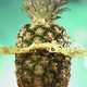 Fresh Pineapple Fruit Squirting and Burst with Juice in Slow Motion in Turquoise Blue Background - VideoHive Item for Sale