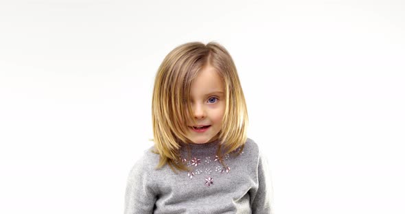 Beautiful Happy Fun Young Child Blond Smarty Girl Smiling and Making Faces alt