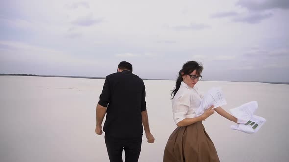  Law Students Man and Woman Rejoice at Passing Exams Dancing at Seaside