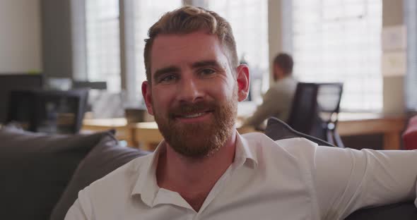 Young creative professional working in a modern office alt