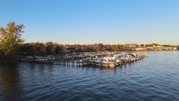 aerial of boats anchored in a pier alt
