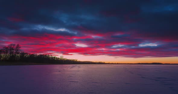Timelapse of Frozen Lake at Sunset Light in Lithuania