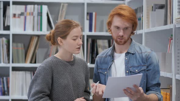 Creative Teammates Busy Doing Paperwork in Office, Discussing Project alt