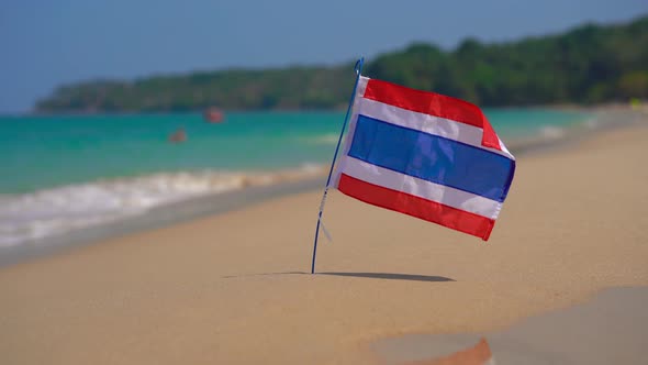 Closeup Shot of a National Flag of Thailand on a Beautiful Beach. Tropical Vacation Concept. Travel alt