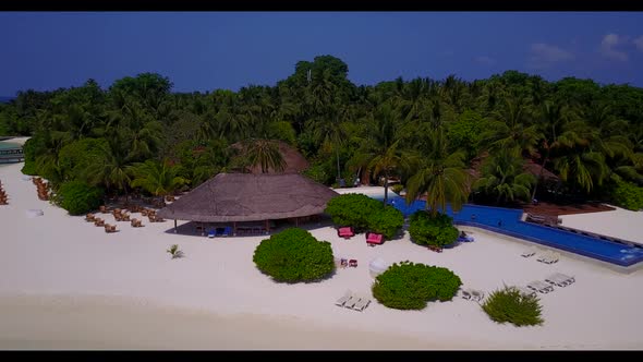 Aerial view scenery of idyllic island beach break by clear ocean and white sand background of a dayt alt