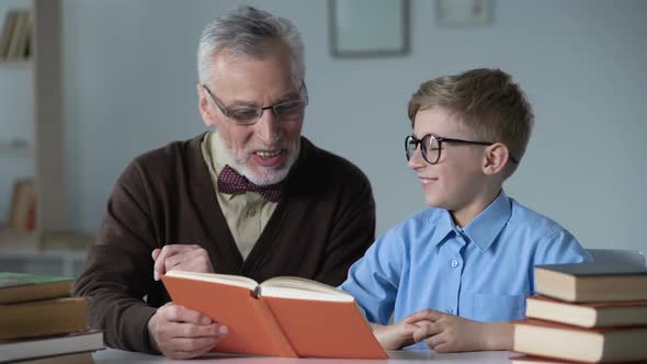 Grandpa Reading Aloud Adventure Story to Little Grandson, Family Care and Warmth alt
