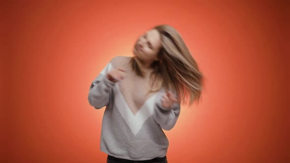 Extremely Happy Blonde Young Woman in Hoodies Dancing Joyfully Enjoying Music alt
