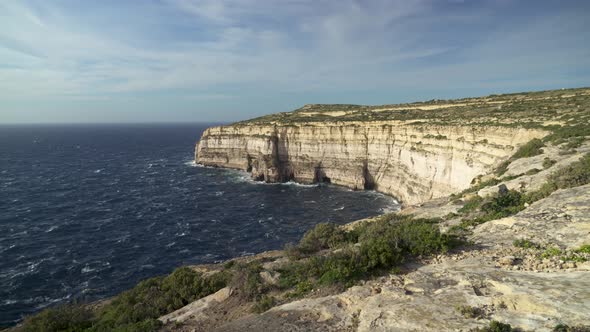 Panoramic View of Mediterranean Sea and Cliffs of Gozo Island on Windy Day alt