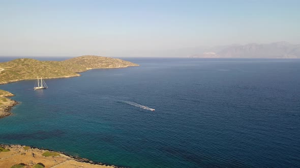 Aerial View of a Motor Boat Towing a Water Skier. Elounda, Crete, Greece