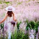 Girl of field flowers Flower Field and Touches Hands - VideoHive Item for Sale