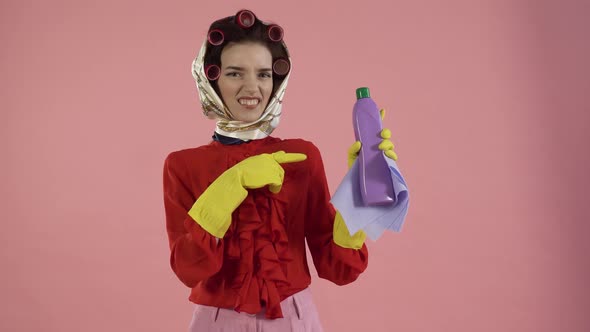 A Female Cleaner Points to a Bottle of Cleaning Agent and Gestures No