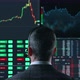 Trader is Working with Multiple Computer Screens Full of Charts and Data Analysis and Stock Broker - VideoHive Item for Sale