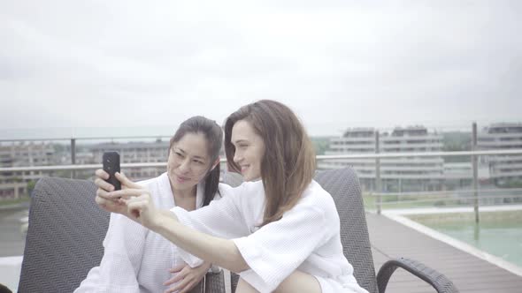 Women posing for selfie at luxury spa