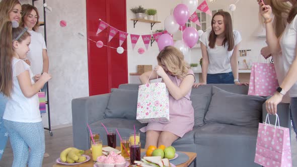 Girl Giving Gift To Pregnant Woman