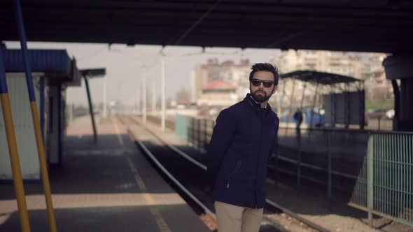 Businessman Commute To Work Sitting On Railway Train Station Platform. City Tourist Transportation. alt