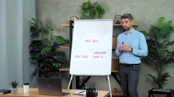 Man coach greets listen talk teaches students online webcam video call laptop alt