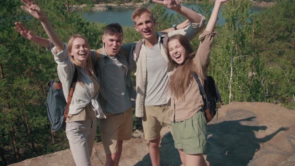 Happy Young Friends Posing for Camera on Hike alt