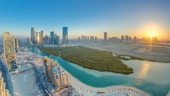 Buildings on Al Reem Island in Abu Dhabi at Sunset Timelapse From Above alt