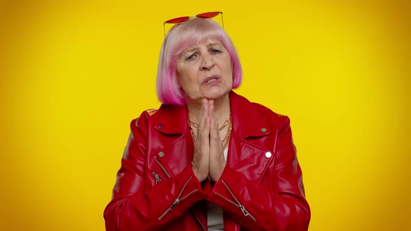 Mature Old Woman Praying to God Making Wish Asking with Hopeful Imploring Expression Begging Apology alt