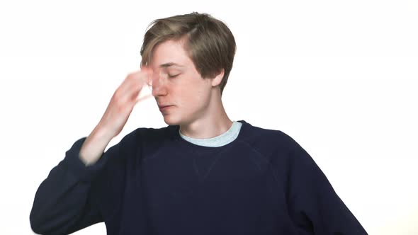 Portrait of Attractive Teenage Boy Wearing Braces Posing on Camera Touching Hair Expressing It Didn alt