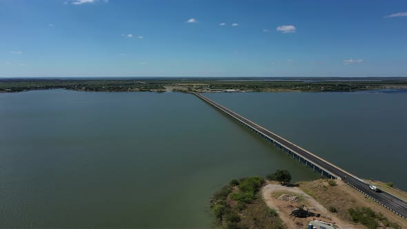 Long bridge over a lake. alt