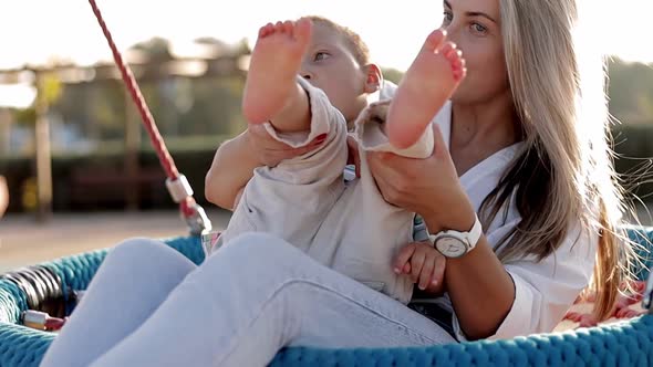 Happy Mom Proud of Her Son Can Walking Outdoors alt
