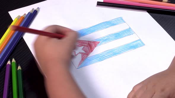 Child's hands drawing flag of Cuba