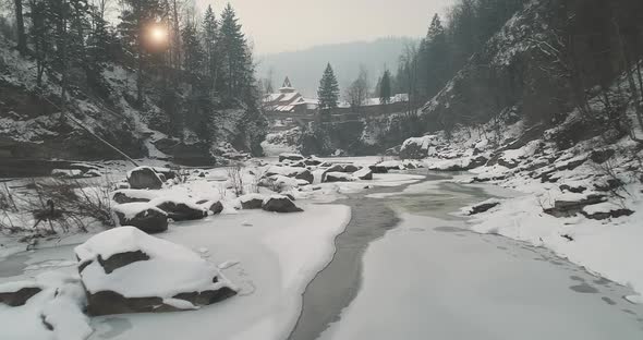 Mountain River in Ice Snow at Sun Pine Forest Aerial alt
